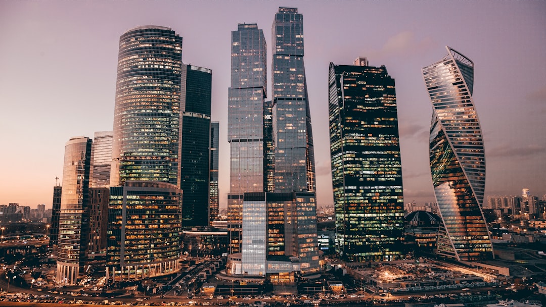a group of skyscrapers in a city at night